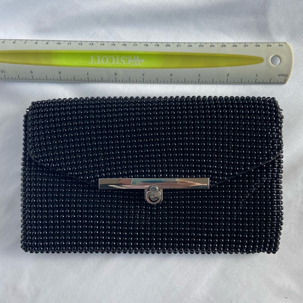 Black 3D dot clutch with strap